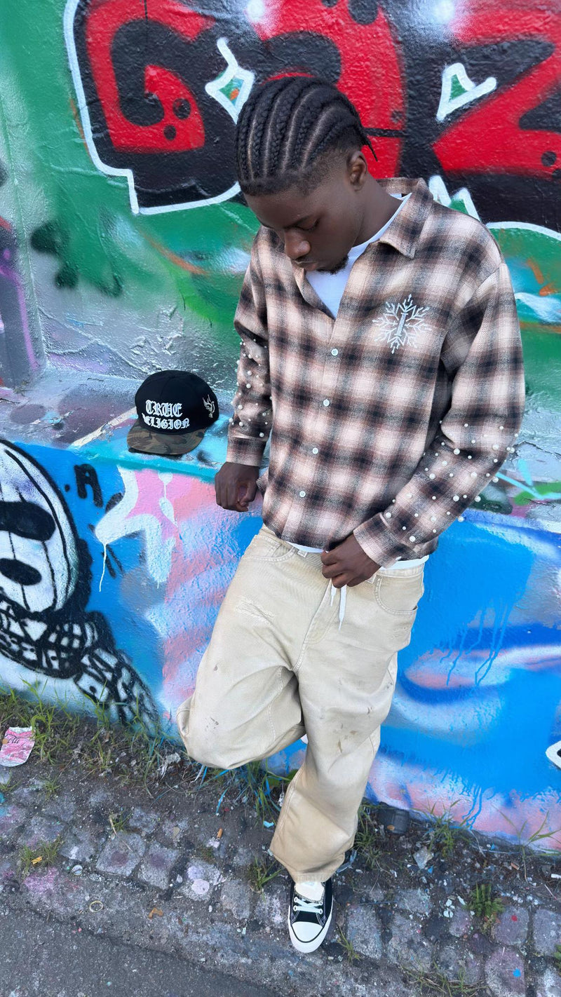 Brown Pearl Flannel worn in front of a graffiti wall